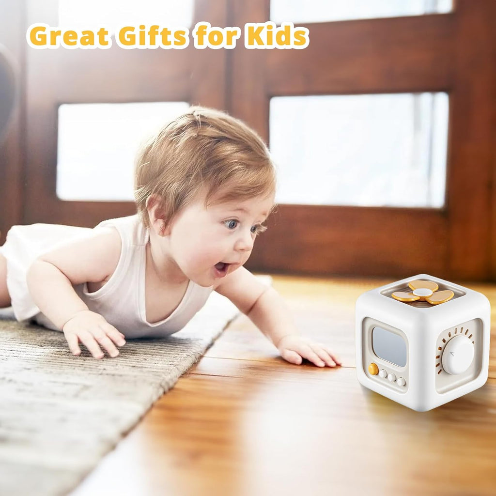 Baby crawling toward a cube toy with ix different learning activities.