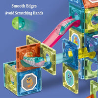 Close-up view of a colorful DIY magnetic marble run toy in action, with smooth edges and translucent tracks guiding marbles safely through various tunnels and curves.