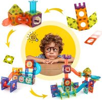 A curious child in the center surrounded by colorful DIY magnetic marble run pieces and assembled structures, illustrating creativity, STEM learning, and imaginative play.