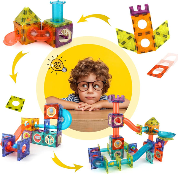 A curious child in the center surrounded by colorful DIY magnetic marble run pieces and assembled structures, illustrating creativity, STEM learning, and imaginative play.