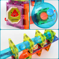Close up on translucent tiles and pieces from the DIY Magnetic Marble Run toy set for children. 