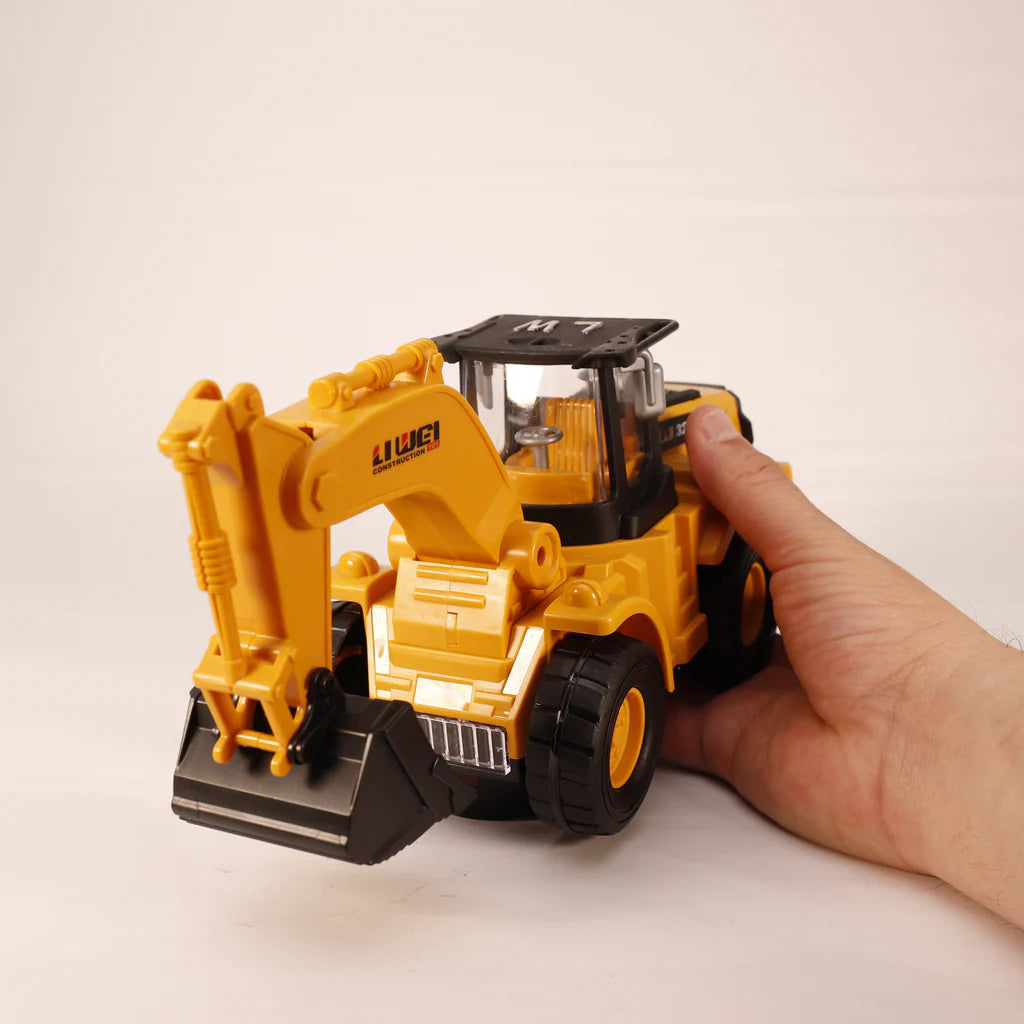 Hand holding a yellow excavator toy with LED lights and music. 