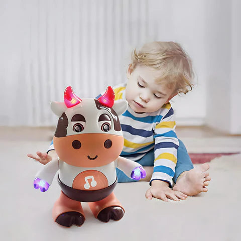 Child playing with a Disco Cow toy.