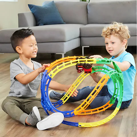 Two boys playing with Flip Track Express toy featuring rail tracks and a battery powered train.