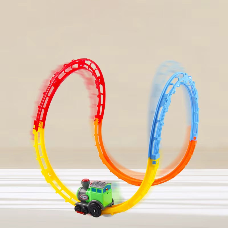 A colorful looping toy train track with red, blue, yellow, and orange sections, featuring a small green train speeding through the loops.