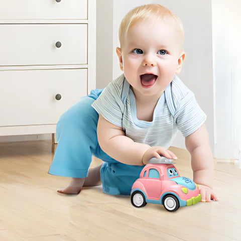 Baby playing with a pink-blue toy car featured in the Hat Zoomers set. 