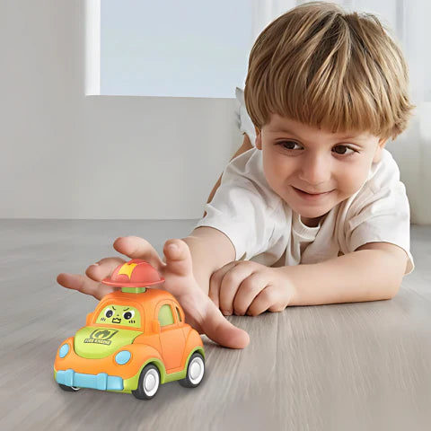 Boy playing with a colorful toy car from the Hat Zoomers set. 