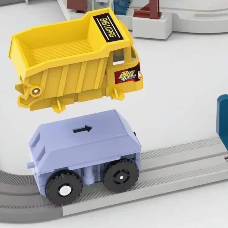 A detachable toy dump truck showing how the yellow truck bed can be removed from the blue base, part of a modular construction toy set.