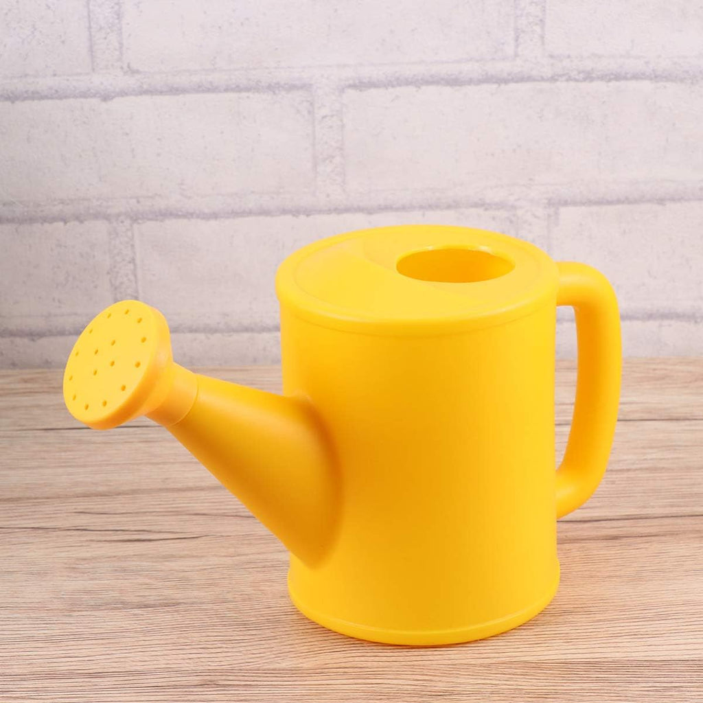 Yellow watering can featured in the Little Botanist Kit. 