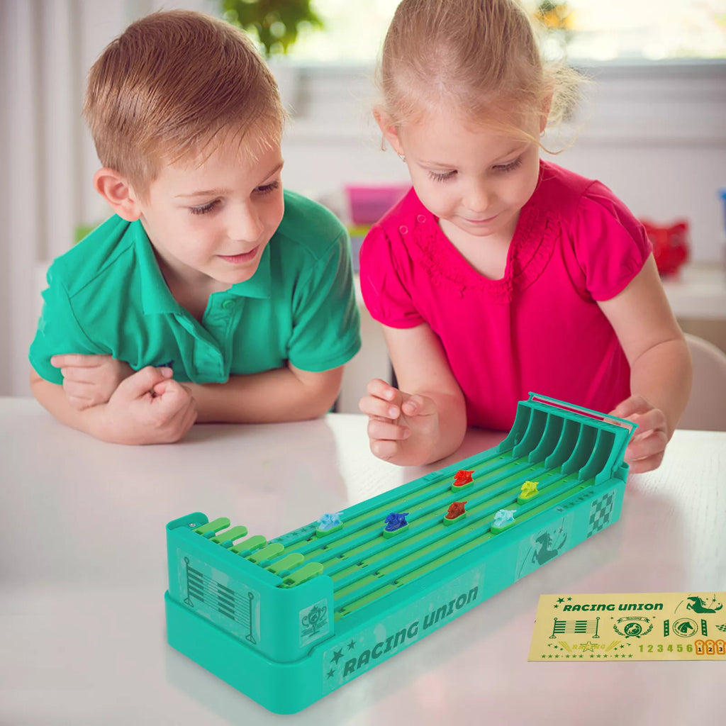 Brother and sister playing with Little Horse Racers game. 