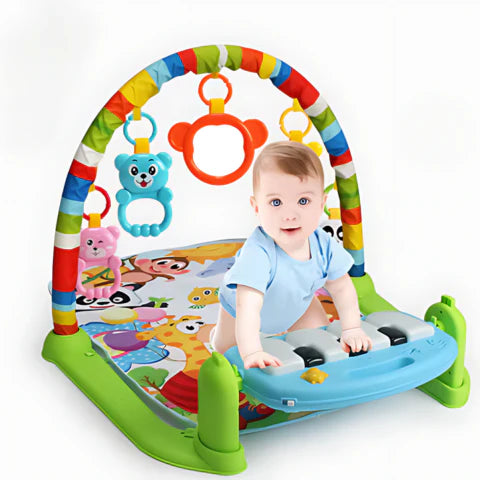 Baby playing a piano toy  attached on a Music Wonder Mat.