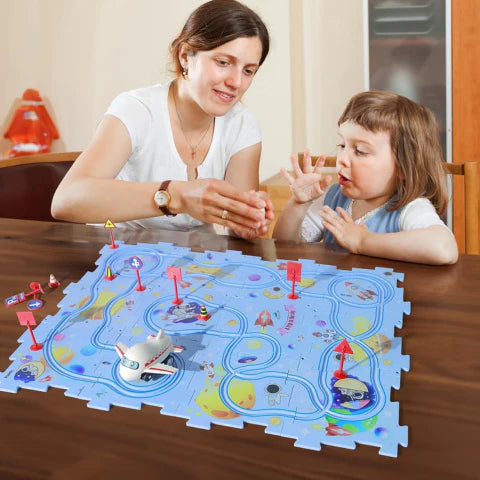 Mother and daughter playing with a Puzzle Track Set that features 15 pieces, and a battery powered airplane which moves on the tracks. 