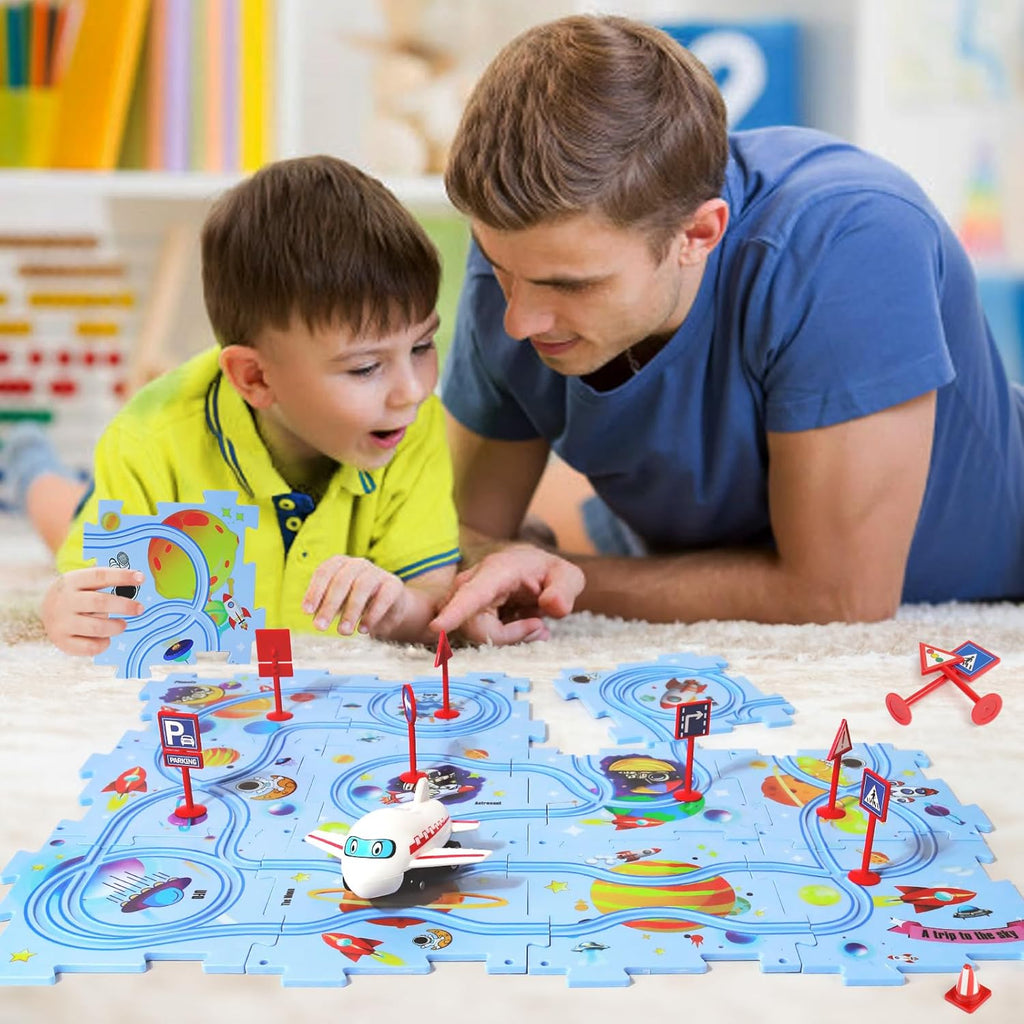 Father and son building a track and putting warning signs on it using pieces from the Puzzle Track Set. 