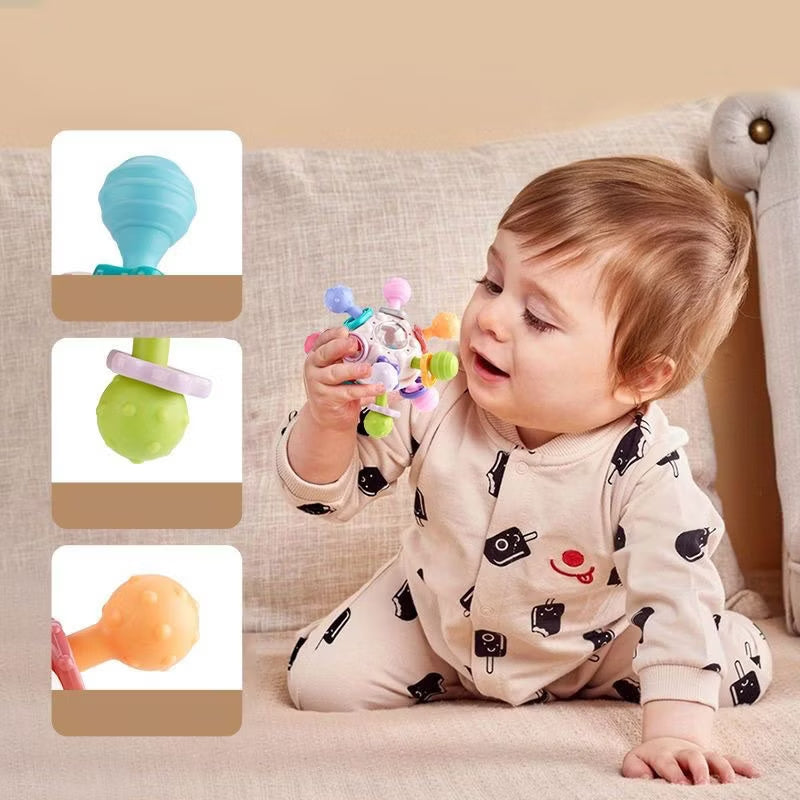 Baby playing with a colorful Sensory Teether toy.