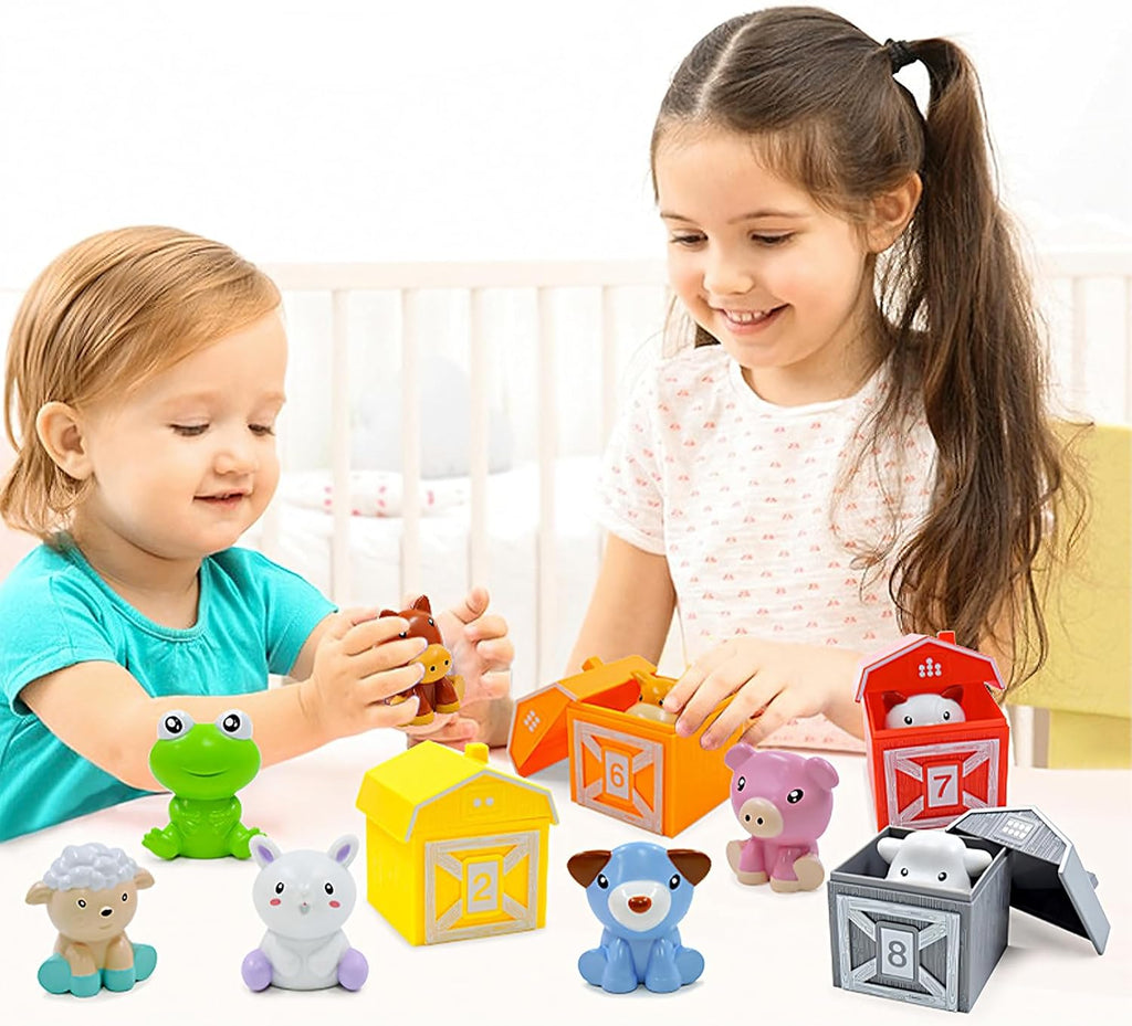 Sisters playing a color and number sorting game that features colorful barns with numbers on them and finger puppet farm animals.