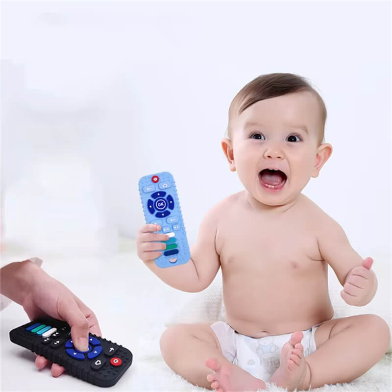 Baby smiling and holding a blue Baby ChewMote teething toy.