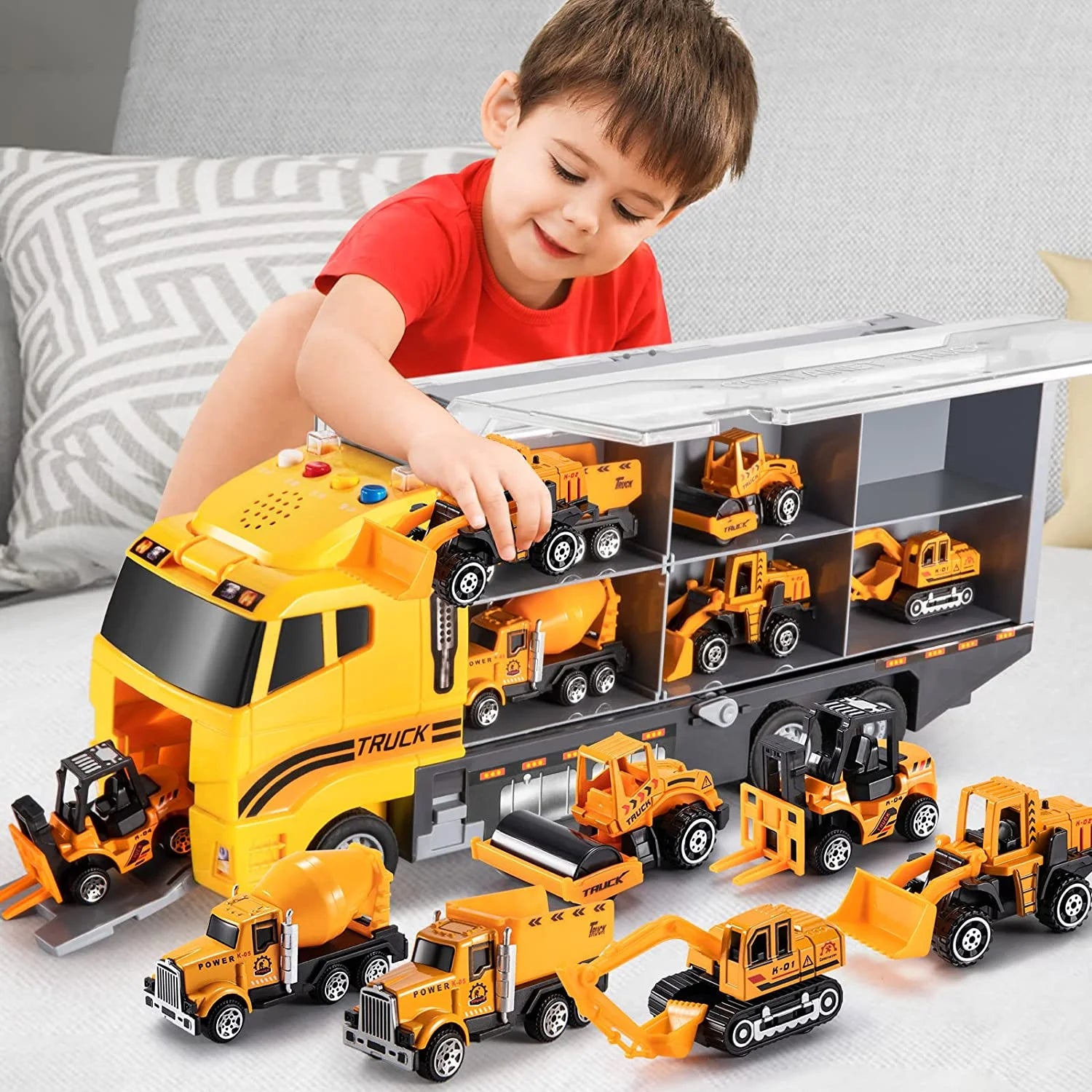 Child playing with his Mega Construction Truck toy.